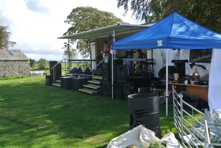 The temporary outdoor stage being prepared for Magic Orchard